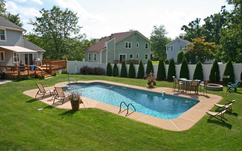This is a photo of a patrician in ground pool in Germantown, NY with custom pavers and steps.