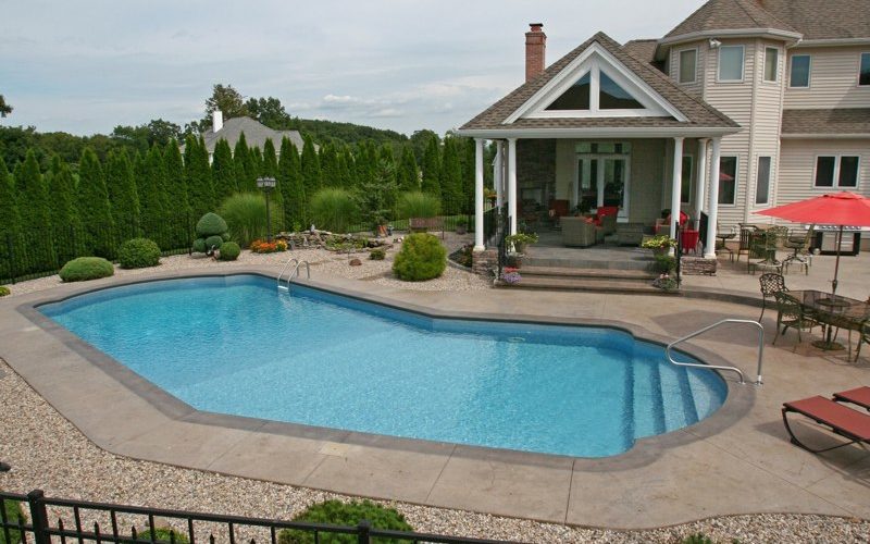 This is a photo of a Lazy L style custom inground swimming pool