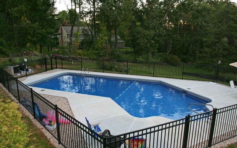 This is a photo of a custom Lazy L style inground swimming pool.